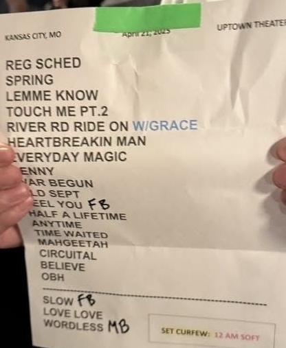 Auto-generated description: A person is holding a setlist for a performance at Uptown Theater in Kansas City, MO, dated April 24, 2023.